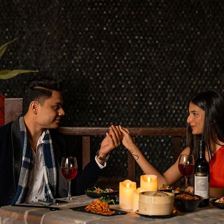 Hyatt Pune Bagian luar foto A couple dining together