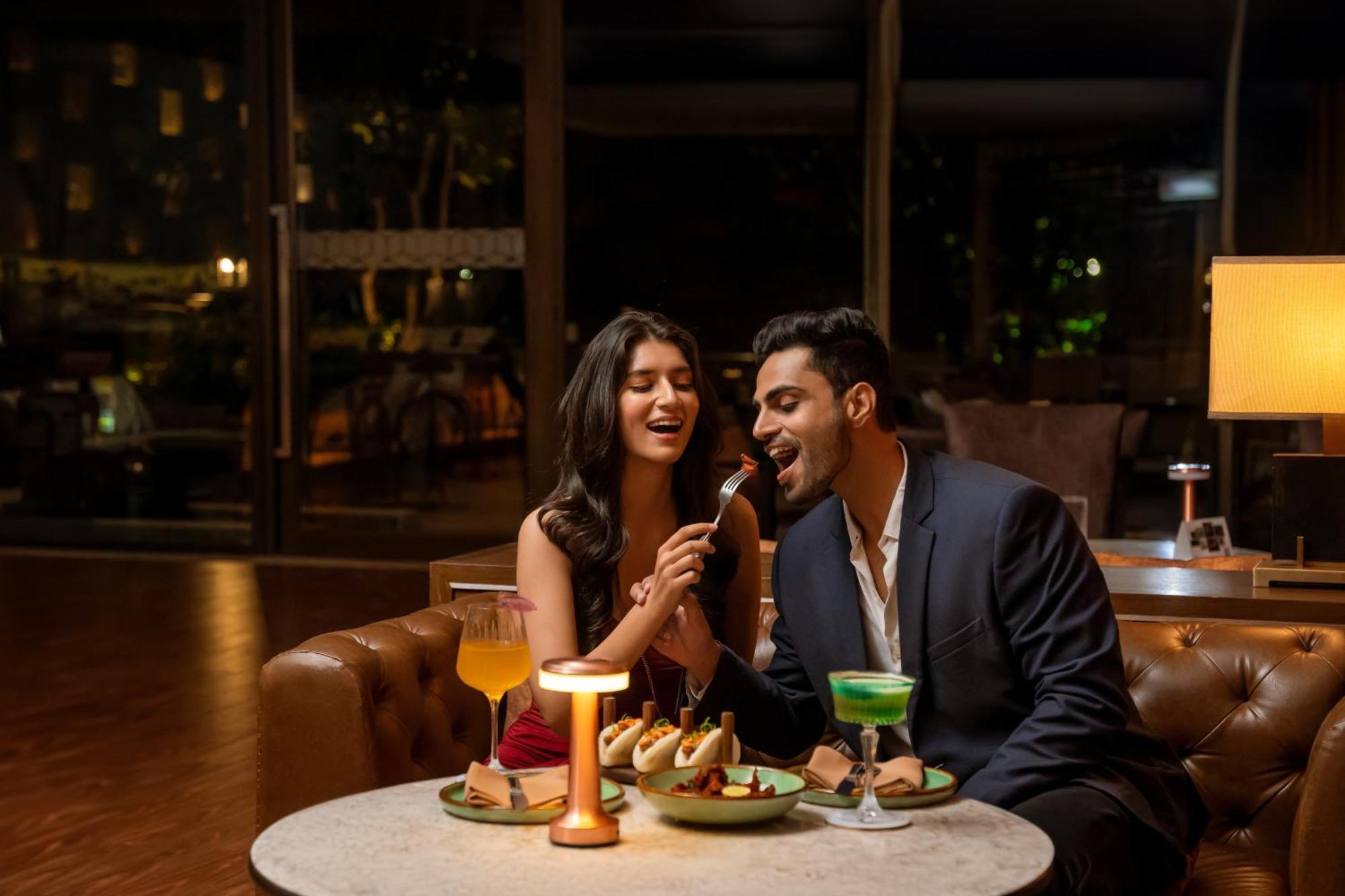 Hyatt Pune Bagian luar foto A couple dining at a restaurant