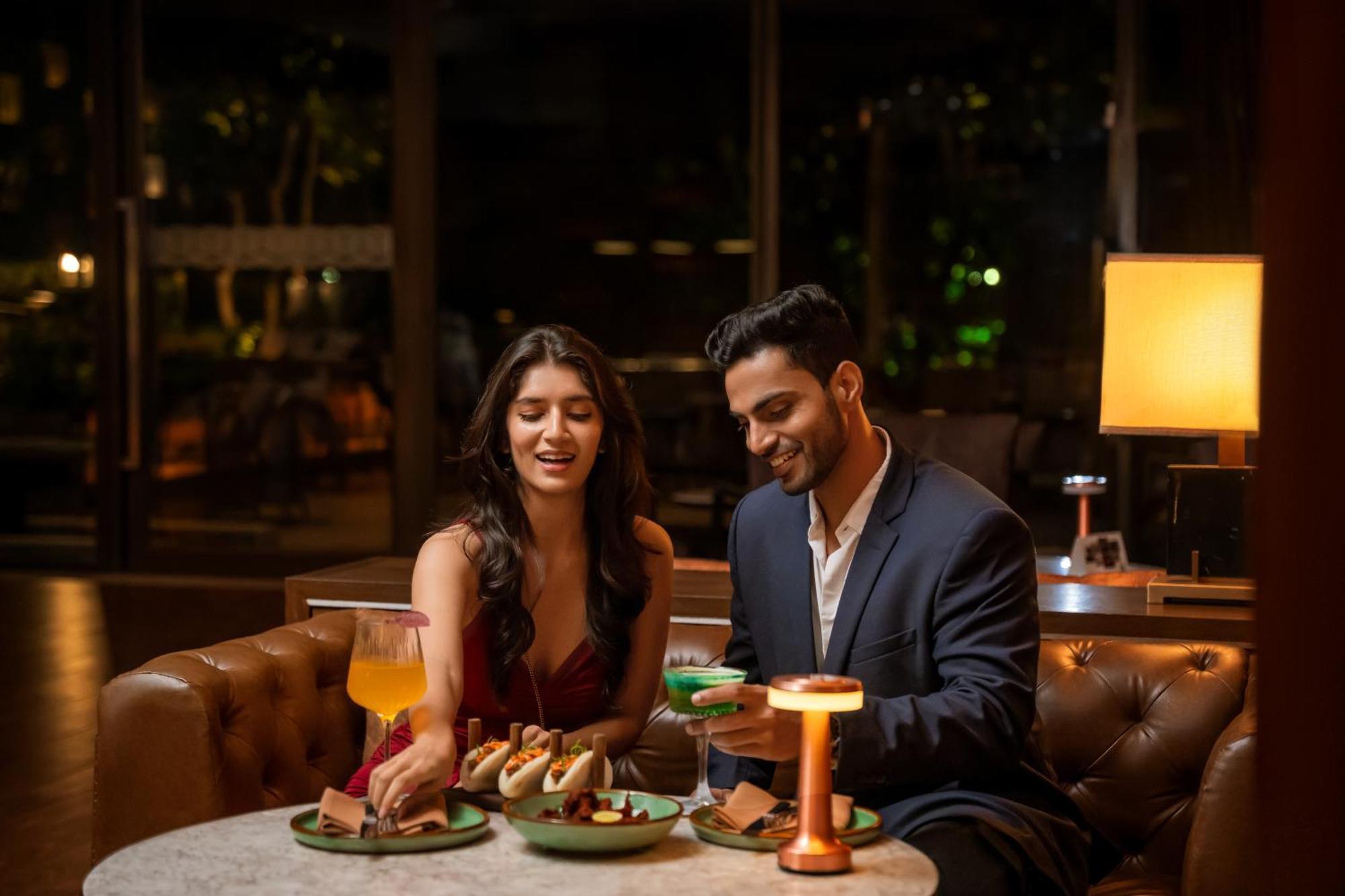 Hyatt Pune Bagian luar foto A couple dining at a restaurant