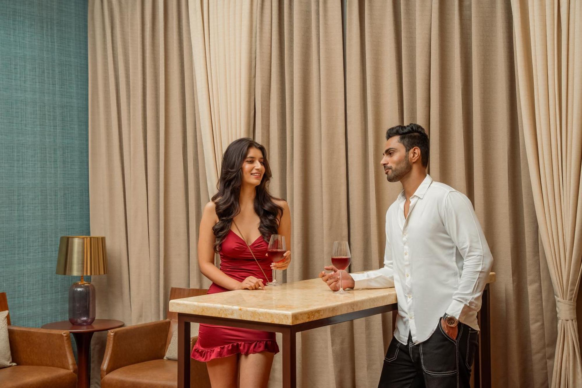 Hyatt Pune Bagian luar foto A couple at a bar