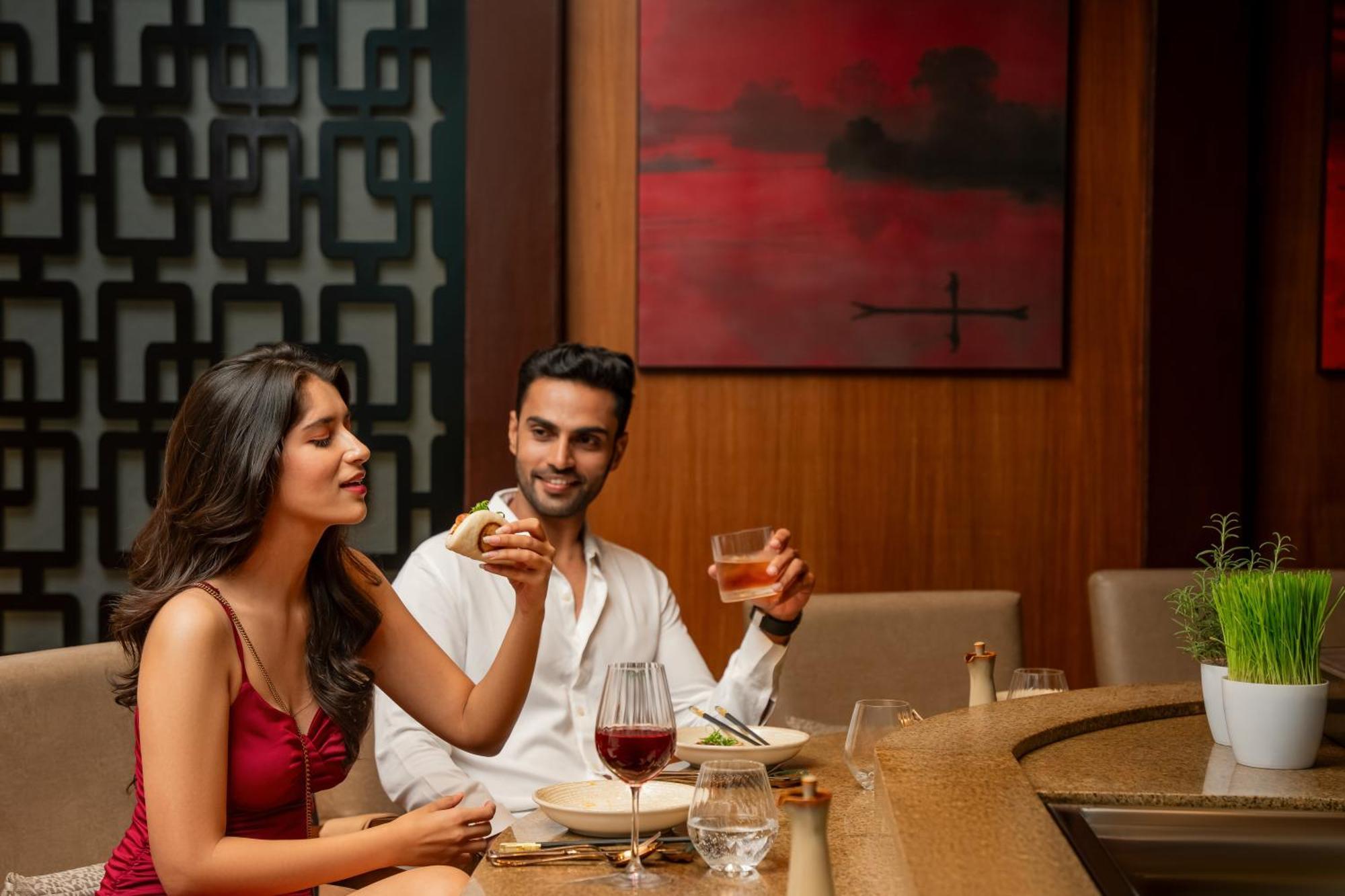 Hyatt Pune Bagian luar foto A couple dining at a restaurant